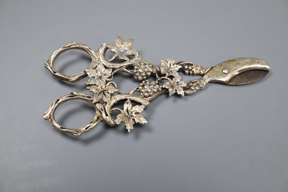 A pair of Continental silver grape scissors, a cased set of six silver cake forks and sundry items